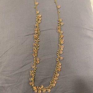 Long yellow metal with clear peach bead necklace